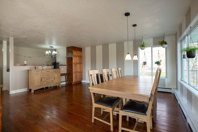 dining area featuring a chandelier, a healthy amount of sunlight, and dark wood-type flooring