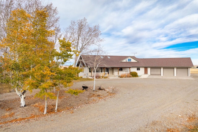 view of front of property with a garage and covered porch