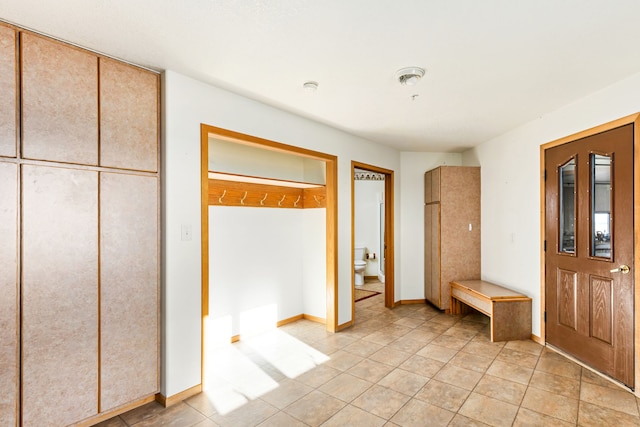 451 1st Rd NE, Fairfield, MT 59436 - unfurnished bedroom with light tile patterned floors and baseboards