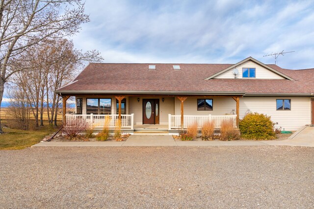 451 1st Rd NE, Fairfield, MT 59436 - view of front of home featuring covered porch and a shingled roof