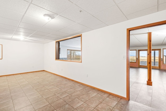 451 1st Rd NE, Fairfield, MT 59436 - spare room with plenty of natural light, a paneled ceiling, and light tile patterned flooring