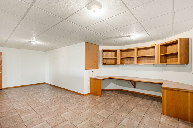 451 1st Rd NE, Fairfield, MT 59436 - unfurnished office with built in study area, a drop ceiling, and light tile patterned flooring