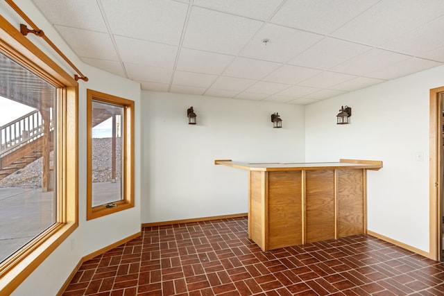 451 1st Rd NE, Fairfield, MT 59436 - indoor dry bar with brick patterned flooring and a paneled ceiling