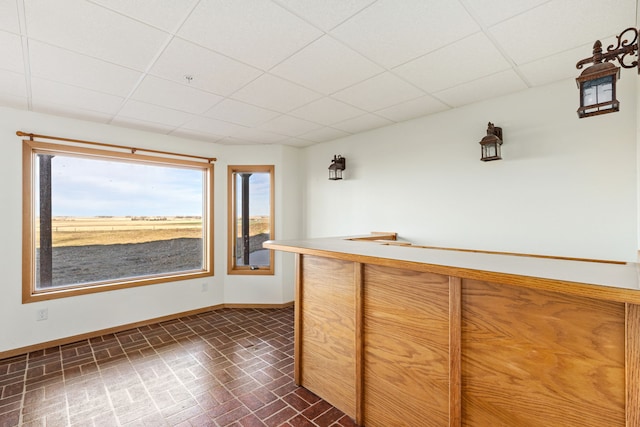 451 1st Rd NE, Fairfield, MT 59436 - indoor dry bar with a drop ceiling and brick patterned flooring