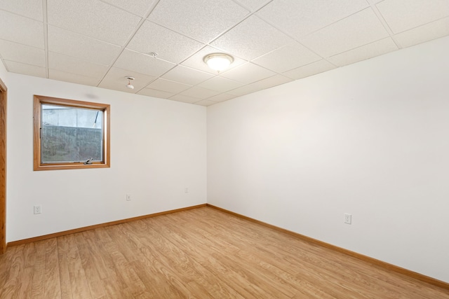 451 1st Rd NE, Fairfield, MT 59436 - unfurnished room featuring light wood-type flooring and a paneled ceiling