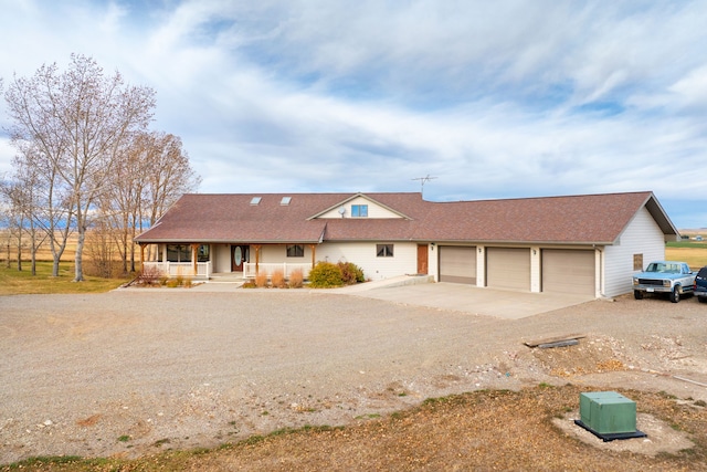 451 1st Rd NE, Fairfield, MT 59436 - view of front of home with driveway, covered porch, a garage, and a shingled roof