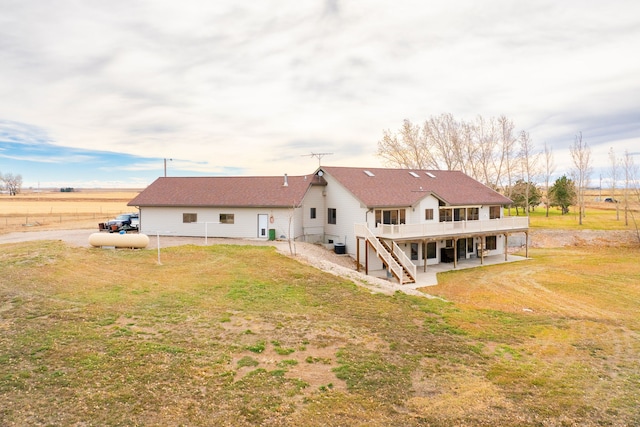451 1st Rd NE, Fairfield, MT 59436 - back of property with a deck, a patio area, and stairway