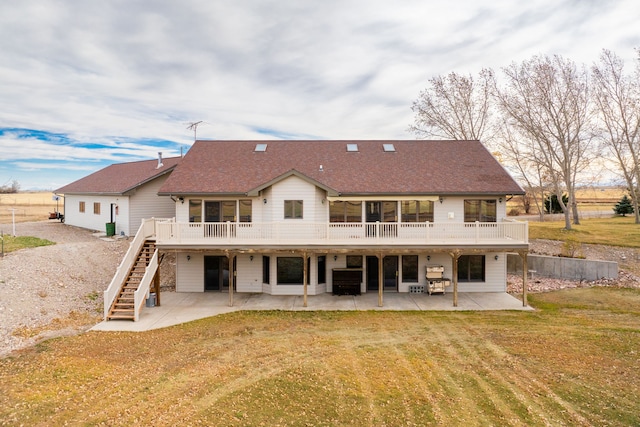 451 1st Rd NE, Fairfield, MT 59436 - rear view of house featuring a patio area, stairs, a wooden deck, and a yard