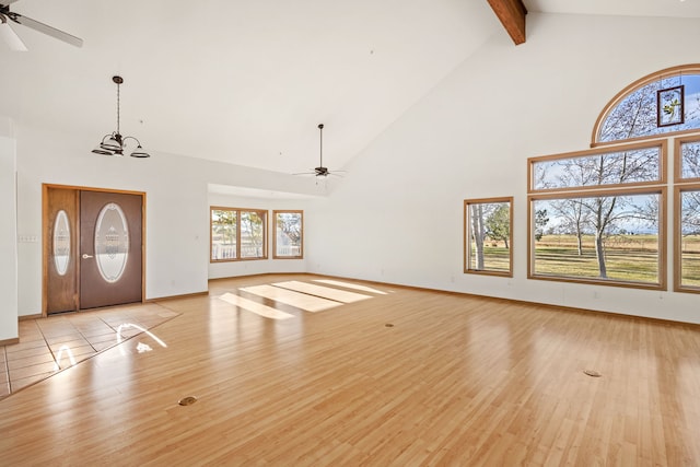 451 1st Rd NE, Fairfield, MT 59436 - foyer entrance featuring high vaulted ceiling, ceiling fan, beamed ceiling, light wood finished floors, and plenty of natural light