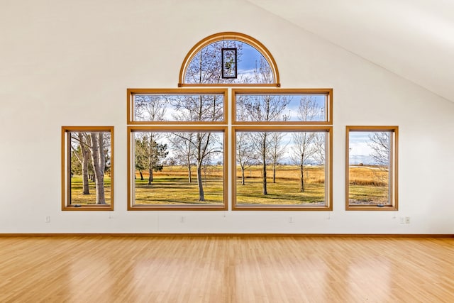 451 1st Rd NE, Fairfield, MT 59436 - unfurnished living room with high vaulted ceiling and light wood-style flooring