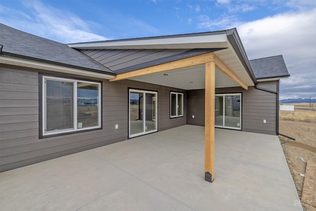 rear view of property featuring a patio