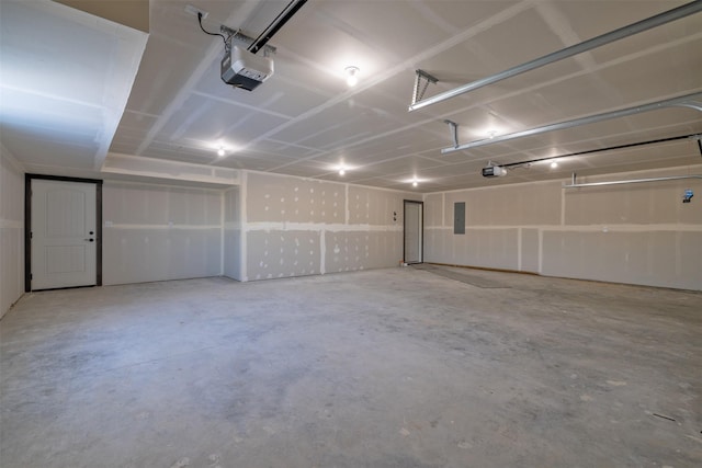 garage featuring a garage door opener and electric panel