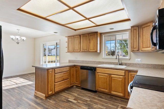 kitchen with kitchen peninsula, sink, a healthy amount of sunlight, and stainless steel appliances