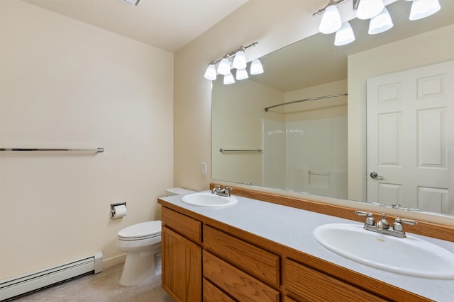 bathroom featuring toilet, vanity, walk in shower, and a baseboard radiator