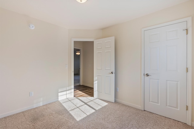 unfurnished bedroom with carpet floors