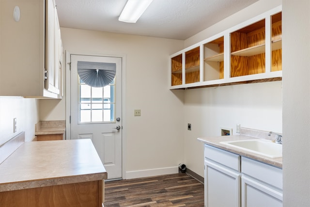 clothes washing area featuring hookup for an electric dryer, washer hookup, a textured ceiling, dark hardwood / wood-style floors, and sink