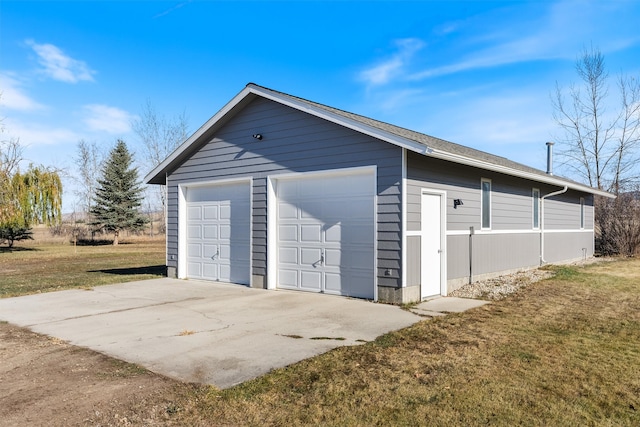 garage featuring a yard