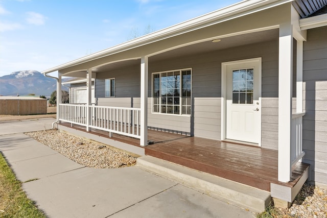 property entrance with a mountain view and covered porch