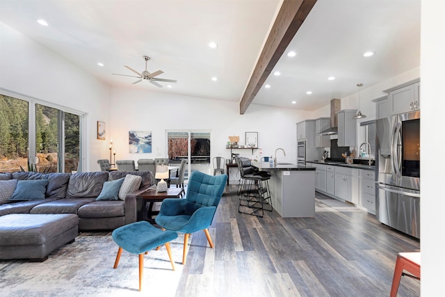 living room featuring high vaulted ceiling, ceiling fan, dark hardwood / wood-style floors, and beam ceiling