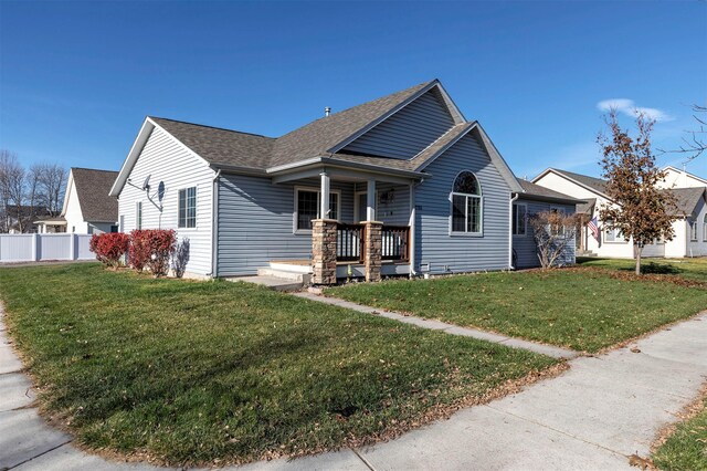 view of front of property with a front lawn and a porch