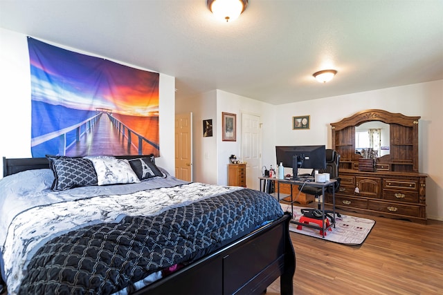 bedroom featuring wood-type flooring