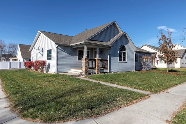 view of front of home with a front lawn and a porch