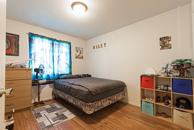 bedroom featuring hardwood / wood-style flooring