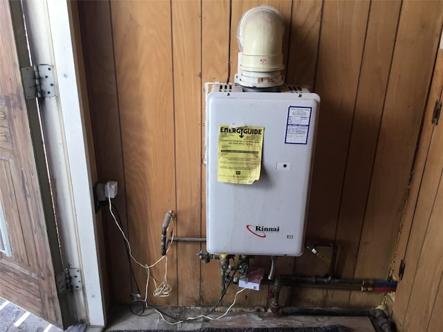 utility room with water heater