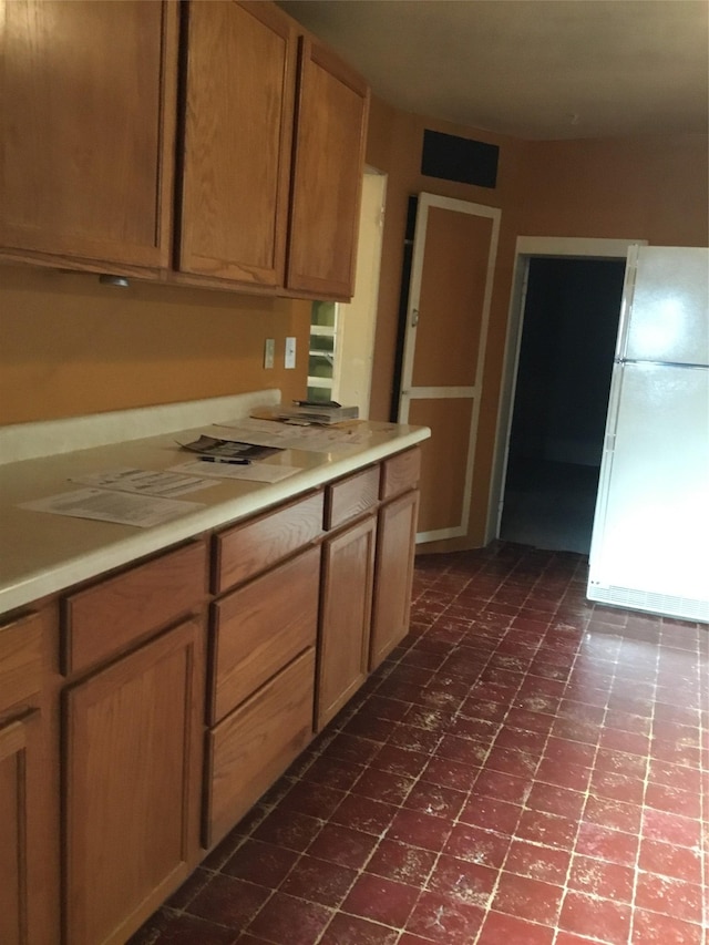 kitchen featuring white refrigerator