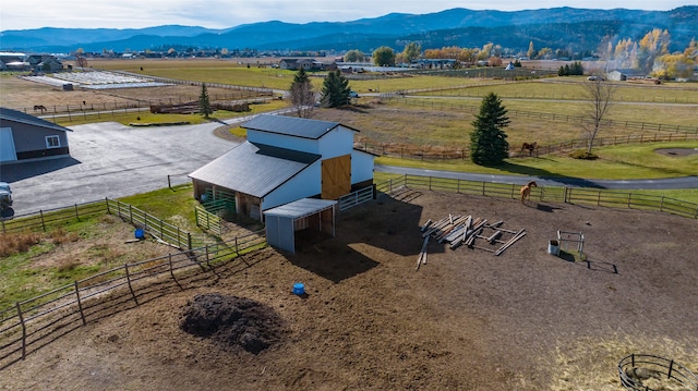 birds eye view of property with a rural view and a mountain view