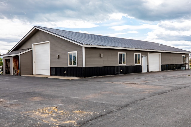 rear view of house with a garage