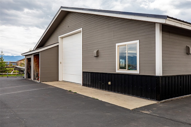 view of side of property with a garage