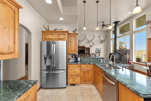 kitchen featuring sink, appliances with stainless steel finishes, ceiling fan, light tile patterned floors, and pendant lighting