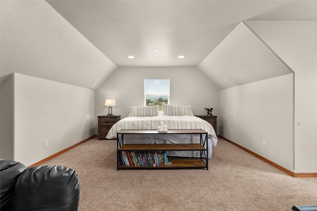 carpeted bedroom with vaulted ceiling