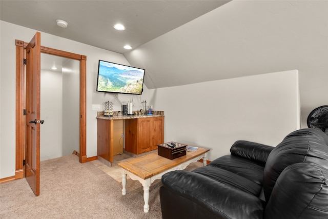 interior space featuring bar and lofted ceiling