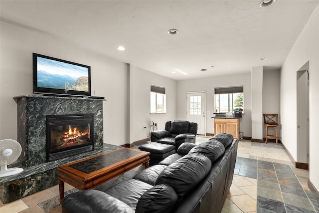 living room featuring a premium fireplace