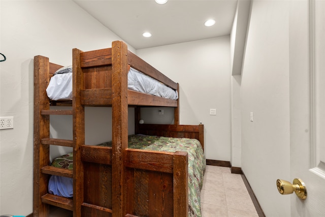 bedroom with light tile patterned floors