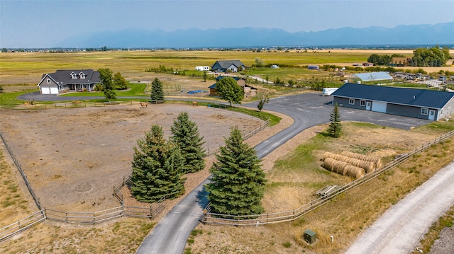 drone / aerial view with a rural view and a mountain view