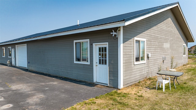 view of property exterior with a garage