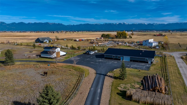 birds eye view of property with a mountain view and a rural view