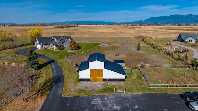 aerial view featuring a mountain view and a rural view