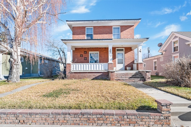 view of front of home with a front lawn and covered porch