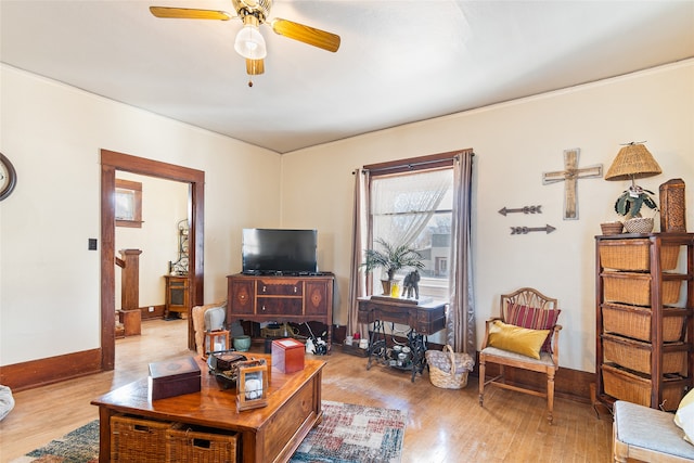 living room with ceiling fan and light wood-type flooring