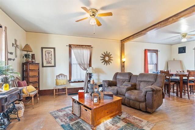 living room featuring ceiling fan and light wood-type flooring