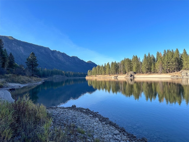 4895 Mt Highway 200, Thompson Falls, MT 59873 - water view with a heavily wooded area and a mountain backdrop