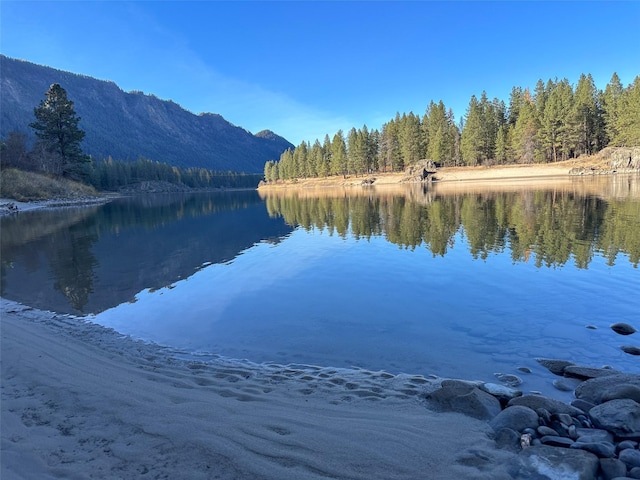 4895 Mt Highway 200, Thompson Falls, MT 59873 - water view with a heavily wooded area and a mountainous background