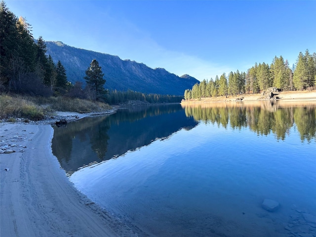 4895 Mt Highway 200, Thompson Falls, MT 59873 - water view with a heavily wooded area and a mountain backdrop