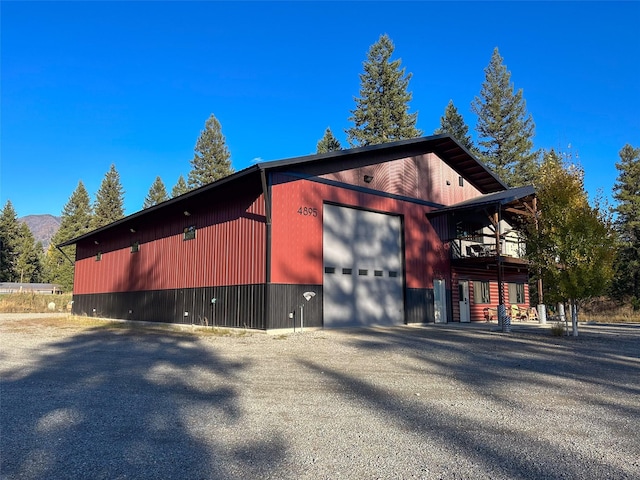 4895 Mt Highway 200, Thompson Falls, MT 59873 - view of side of home with a detached garage and a mountain view