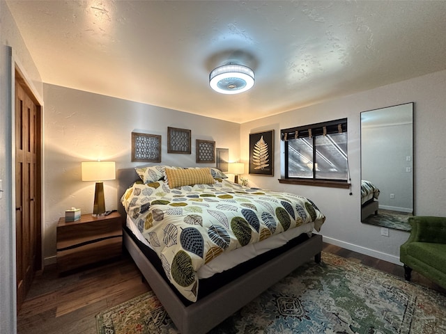 bedroom featuring dark hardwood / wood-style flooring