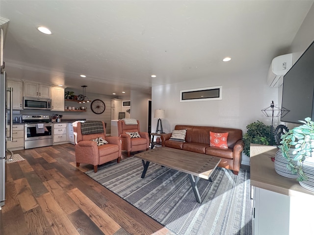 living room with a wall unit AC and dark hardwood / wood-style flooring